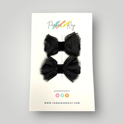 Set of two black tulle and velvet hair bow clips on a Parker & Kay branded card.