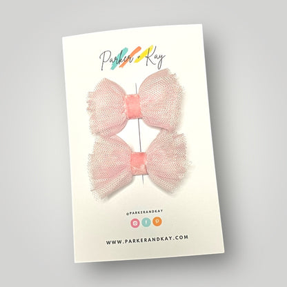 Set of two soft pink tulle and velvet hair bow clips on a Parker & Kay branded card.